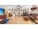 Inviting living room featuring hardwood floors, natural light, and comfortable seating at 5020 Broadmore Dr, Auburndale, FL 33823