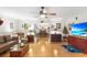 Spacious living room with hardwood floors, flowing into the dining area, ideal for entertaining at 5020 Broadmore Dr, Auburndale, FL 33823