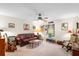 Inviting living room with a comfortable leather sofa and unique decor at 5020 Broadmore Dr, Auburndale, FL 33823