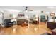 Bright living room with hardwood floors offering a flexible layout perfect for entertaining guests at 5020 Broadmore Dr, Auburndale, FL 33823