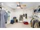 Walk-in closet with shelves, hanging rods, and natural light from a window at 5020 Broadmore Dr, Auburndale, FL 33823