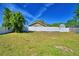 Spacious backyard with a lush lawn and a privacy fence, perfect for outdoor activities at 509 Heather Glen Dr, Winter Haven, FL 33884