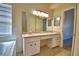 The bathroom offers dual sinks, a big mirror, and a separate tub area for relaxation at 509 Heather Glen Dr, Winter Haven, FL 33884