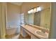 The bathroom boasts dual sinks, a large mirror, and a separate tub area for relaxation at 509 Heather Glen Dr, Winter Haven, FL 33884