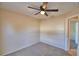 Bedroom with neutral walls, carpet, and a doorway leading to another room at 509 Heather Glen Dr, Winter Haven, FL 33884