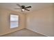Cozy bedroom featuring neutral walls, carpet, and a ceiling fan for added comfort at 509 Heather Glen Dr, Winter Haven, FL 33884
