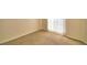 Corner of carpeted bedroom featuring blinds and neutral walls, providing a bright and simple space at 509 Heather Glen Dr, Winter Haven, FL 33884