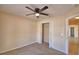 Bedroom with a ceiling fan and a closet, connecting to the hallway and other areas at 509 Heather Glen Dr, Winter Haven, FL 33884