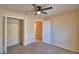 Bedroom with carpet, closet, and view to the hallway with a bathroom at 509 Heather Glen Dr, Winter Haven, FL 33884