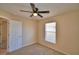 Bedroom featuring carpet, a ceiling fan, and a window for natural lighting at 509 Heather Glen Dr, Winter Haven, FL 33884