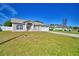 Attractive one-story home with manicured lawn, attached garage and white picket fence at 509 Heather Glen Dr, Winter Haven, FL 33884