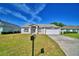 Charming single-story home with a well-manicured lawn and inviting curb appeal at 509 Heather Glen Dr, Winter Haven, FL 33884