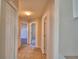 The hallway features tile flooring and access to bedrooms, bathrooms, and living spaces at 509 Heather Glen Dr, Winter Haven, FL 33884