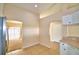Kitchen with tile floor, white cabinets, and pass through to living room at 509 Heather Glen Dr, Winter Haven, FL 33884