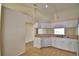 Kitchen featuring tile floor, white cabinets, and stainless steel sink at 509 Heather Glen Dr, Winter Haven, FL 33884