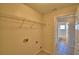Laundry room with washer/dryer hookups and access to a bathroom at 509 Heather Glen Dr, Winter Haven, FL 33884