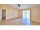 Living room featuring a ceiling fan, tile floors, and neutral paint at 509 Heather Glen Dr, Winter Haven, FL 33884