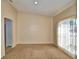 Spacious living room featuring neutral walls, cozy carpeting, and abundant natural light at 509 Heather Glen Dr, Winter Haven, FL 33884