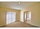 Bright living room featuring neutral paint, carpet, and slider to front door at 509 Heather Glen Dr, Winter Haven, FL 33884