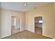 Open-concept living room with neutral paint and tile floors at 509 Heather Glen Dr, Winter Haven, FL 33884