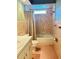 Bathroom with pink tile and bathtub and shower at 579 Saint Andrews Rd, Winter Haven, FL 33884