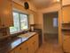 The kitchen boasts stainless appliances and a large window with a view of the outside at 579 Saint Andrews Rd, Winter Haven, FL 33884