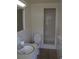 Clean bathroom with tiled walls, tiled shower and a sink with a mirror at 614 Chatham Dr, Lakeland, FL 33803