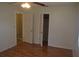 Bedroom showcasing hardwood floors and a closet with a white door that is slightly open at 614 Chatham Dr, Lakeland, FL 33803