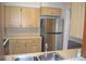 Kitchen featuring ample counter space, stainless steel refrigerator and a kitchen sink at 614 Chatham Dr, Lakeland, FL 33803