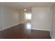 Bright living room featuring wood floors, neutral paint, and lots of natural light at 614 Chatham Dr, Lakeland, FL 33803