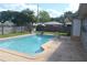 Backyard pool and patio with fencing, offering a private outdoor space at 614 Chatham Dr, Lakeland, FL 33803