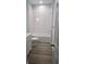 Bathroom showcasing a tub and shower combination with a new vanity and updated flooring at 615 Avenue S Ne, Winter Haven, FL 33881