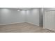 Bright room boasts new laminate flooring, fresh paint, modern ceiling fan, and closet storage at 615 Avenue S Ne, Winter Haven, FL 33881
