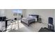Bright bedroom offering natural light, contemporary furniture, and neutral carpeting at 6237 Aralia Ivy Ln, Winter Garden, FL 34787
