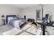 Comfortable bedroom with ample sunlight, stylish decor, and plush carpeting at 6237 Aralia Ivy Ln, Winter Garden, FL 34787