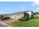 Exterior view of townhomes with attached garages and brick paved driveways at 6237 Aralia Ivy Ln, Winter Garden, FL 34787