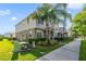 Well-maintained townhome complex with green lawns, sidewalk and mature landscaping at 6237 Aralia Ivy Ln, Winter Garden, FL 34787