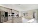 Modern kitchen with stainless steel appliances, granite countertops, and ample cabinet space at 6237 Aralia Ivy Ln, Winter Garden, FL 34787