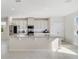 Contemporary kitchen features stainless steel appliances, granite countertops, and center island at 6237 Aralia Ivy Ln, Winter Garden, FL 34787