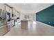 Well-designed kitchen with island, stainless steel appliances, granite counters, and bright lighting at 6237 Aralia Ivy Ln, Winter Garden, FL 34787