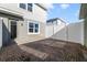 The brick paved patio is surrounded by white privacy fencing at 6237 Aralia Ivy Ln, Winter Garden, FL 34787