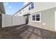 The brick paved patio is surrounded by white privacy fencing at 6237 Aralia Ivy Ln, Winter Garden, FL 34787