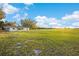 Expansive grassy backyard, perfect for outdoor activities and peaceful enjoyment at 6430 Russo Rd, Bartow, FL 33830