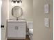 Bathroom featuring updated vanity, granite countertop, updated fixtures, and updated lighting at 6430 Russo Rd, Bartow, FL 33830