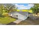 Charming home featuring an attached garage and a sprawling green lawn at 6430 Russo Rd, Bartow, FL 33830