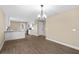 Open concept kitchen flowing into the living room and dining area, perfect for entertaining at 6430 Russo Rd, Bartow, FL 33830