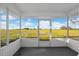 Covered patio offers panoramic views of the lush green landscape with clear blue skies at 6430 Russo Rd, Bartow, FL 33830