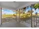 Covered patio offering a serene view of the expansive, picturesque landscape at 6430 Russo Rd, Bartow, FL 33830