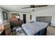 A serene bedroom with a ceiling fan, neutral colors, and a comfortable bed at 6450 Hollyberry Ne Ln, Winter Haven, FL 33881