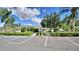 Community clubhouse surrounded by lush greenery, ample parking, and inviting walkways at 6510 Oak Hammock Ln, Winter Haven, FL 33884